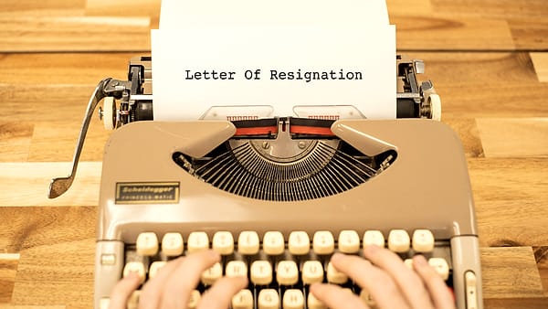 A sheet of paper in a typewriter, part of a letter already typed