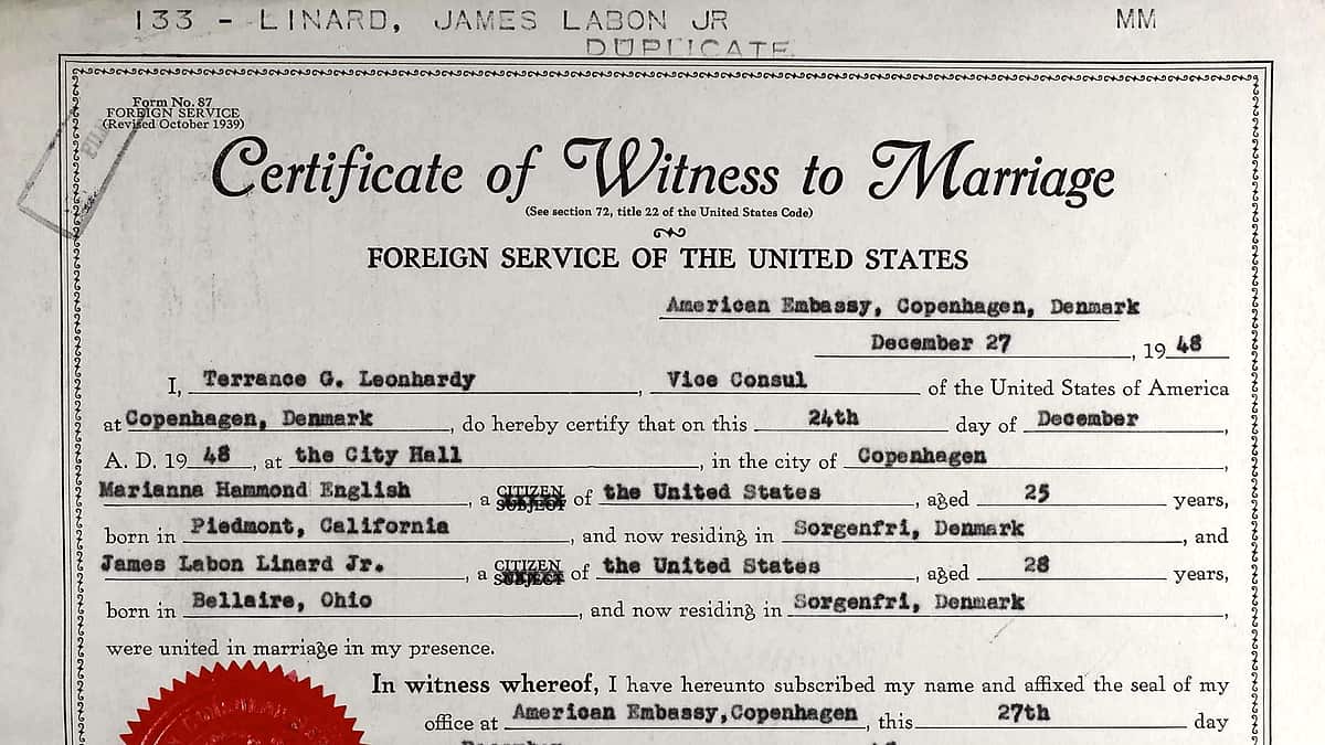 A printed certificate of witness lying flat, its fields completed by hand
