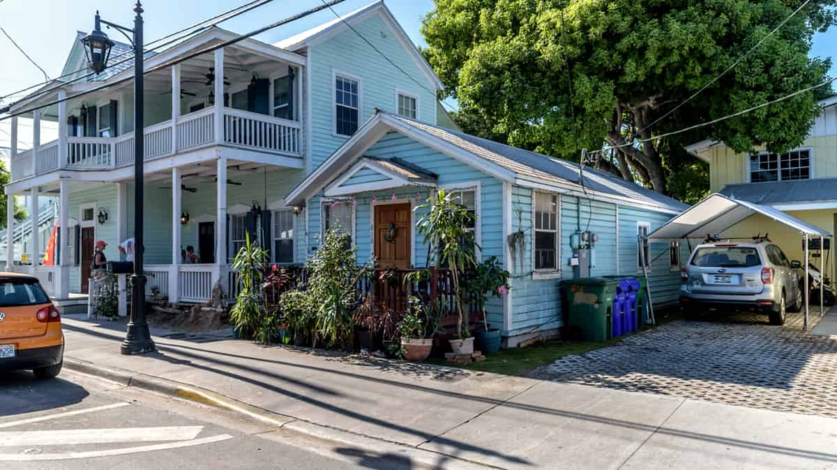 A painted timber house photographed from the street in daylight